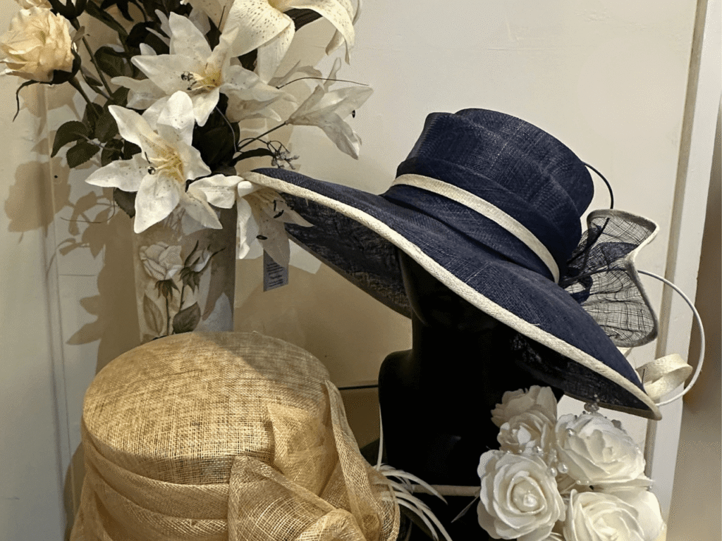 a dark blue had, artificial bouquet arrangement on a display table