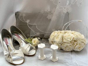 a pair of silver shows, a bag and some general wedding accessories
