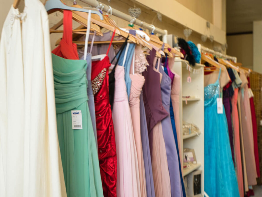 selection of colorful bridesmaid dresses on a clothes rail