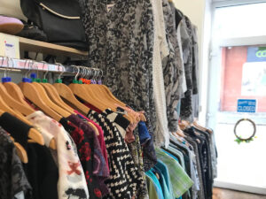 clothes on a rail inside a shop
