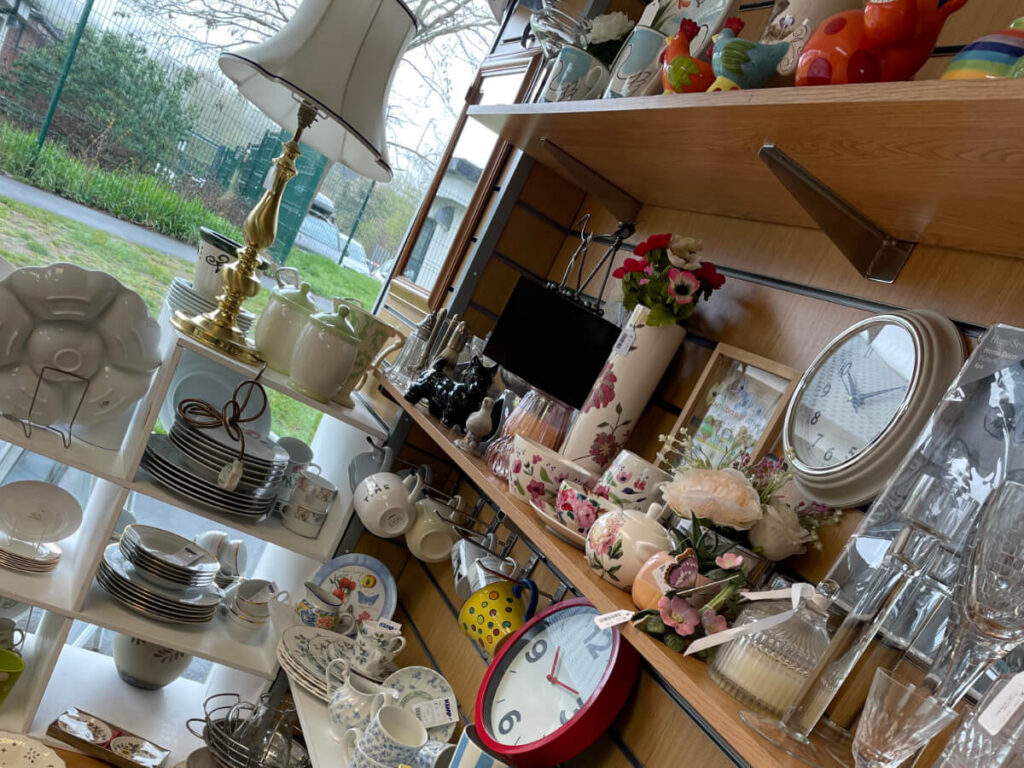 selection of household items on shelves in a shop