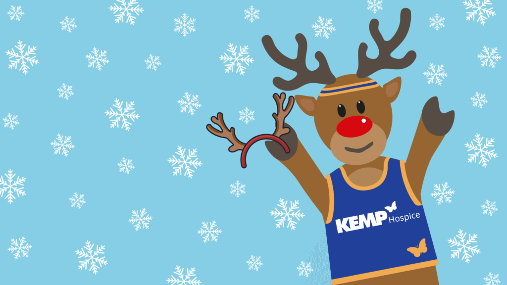Image of a reindeer wearing a running vest and holding an antler headband