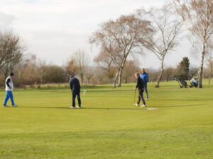 a group of people on a golf course