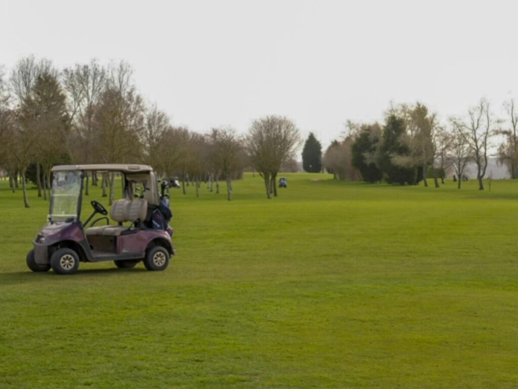 a golf buggy on a golf course