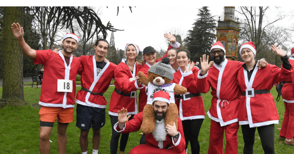 Group of people wearing santa suits