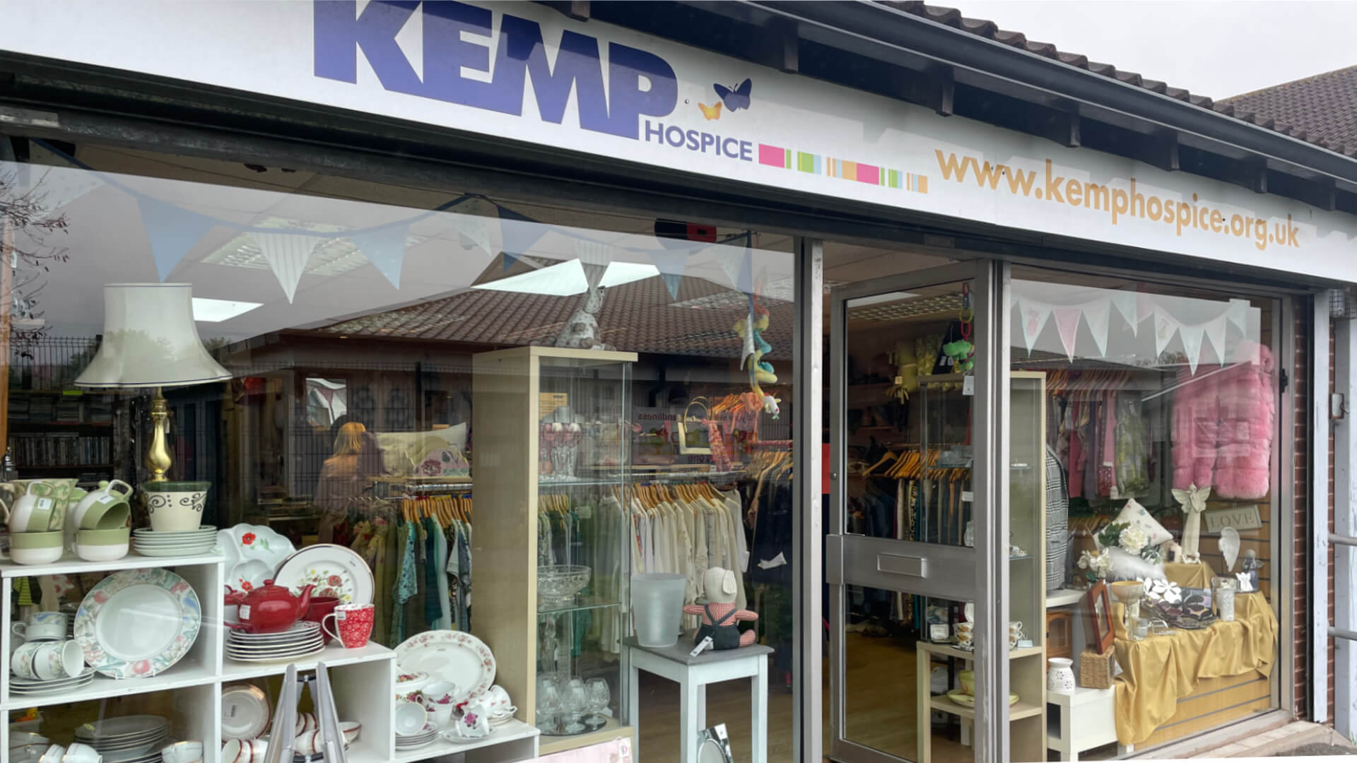 shop front showing windows with items in the windows
