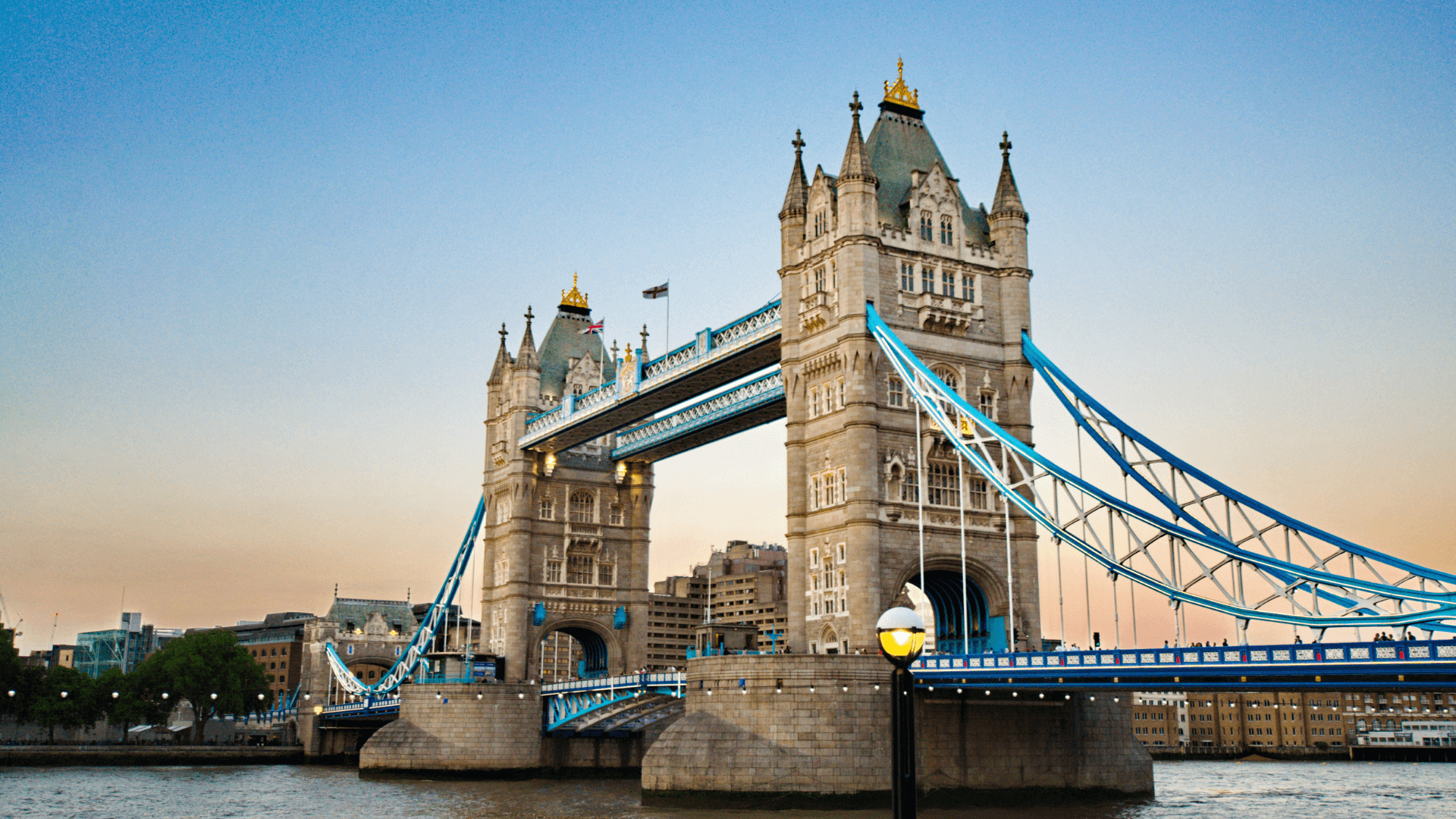tower bridge in London at dusk with a blue and orange sky