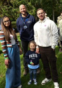 two gentleman, a lady and a young girl stand together in the grounds of Bodenham Arboretum in kidderminster