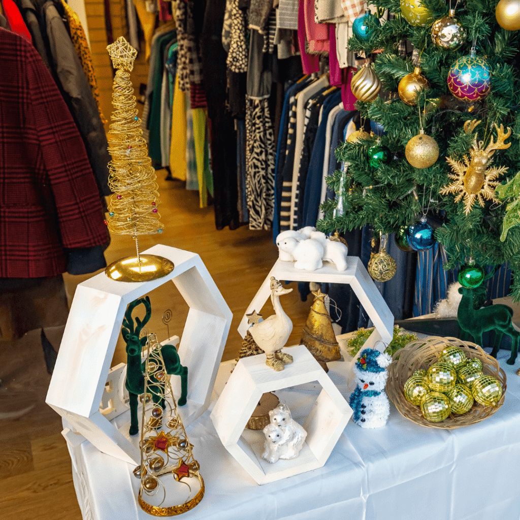 a selection of christmas decorations in a shop window